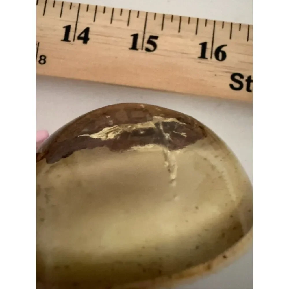 Vintage homemade paperweight with cloth or wood object